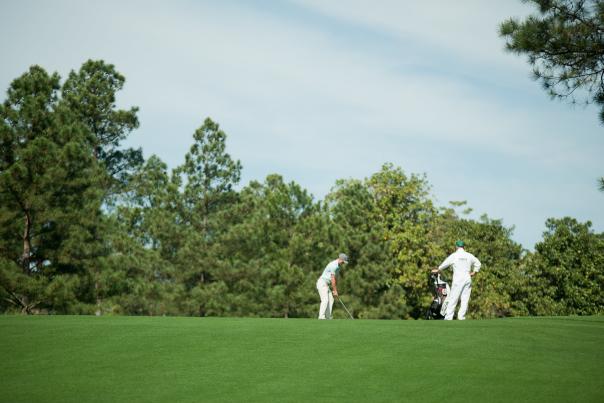 Golfer and Caddie on the Course | Masters
