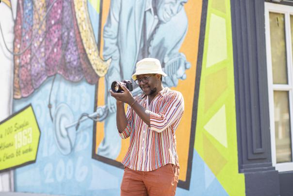 Visitor taking photo of Augusta mural