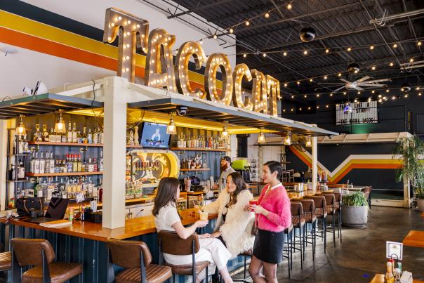 Group of Women Sitting at the Bar in Tacocat