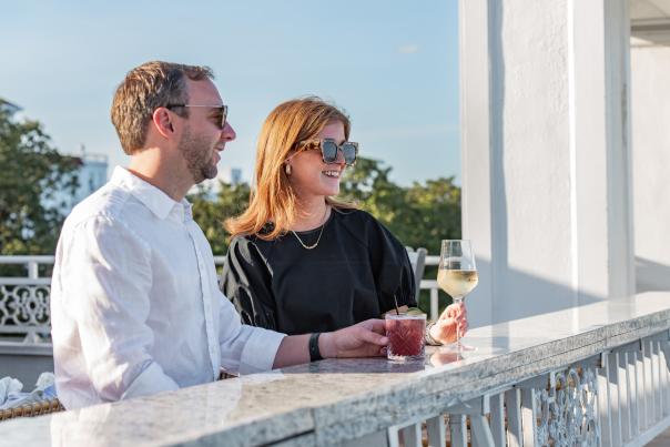 Couple Drinking Cocktails at Six South Rooftop Bar in Partridge Inn
