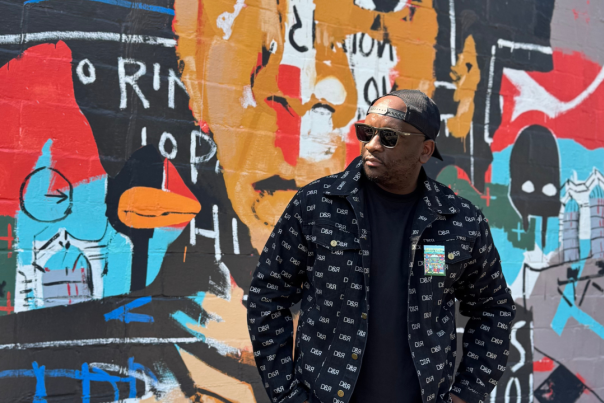 David White in front of Mural