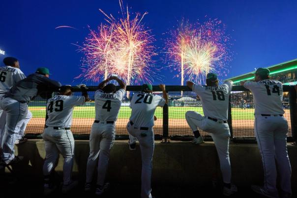 Augusta Greenjackets players watching fireworks at night