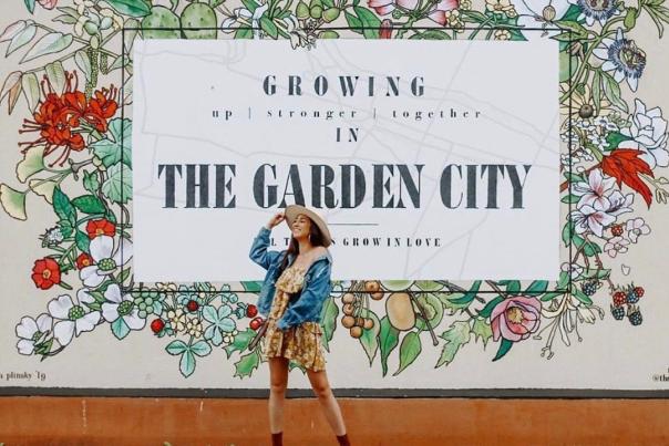 Women Posing In Front of Garden City Mural in Augusta