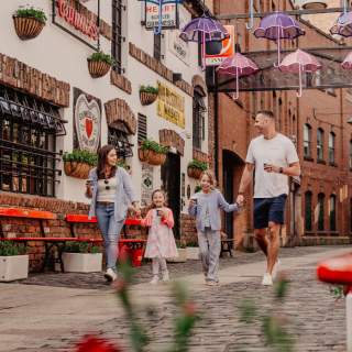 Family walking through Cathedral Quarter