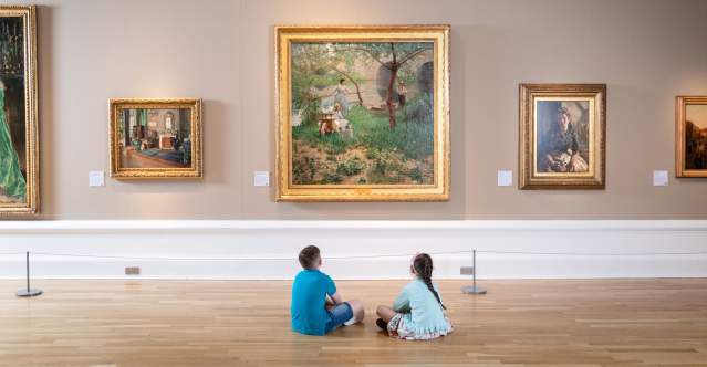 Two children at Ulster Museum looking at artwork