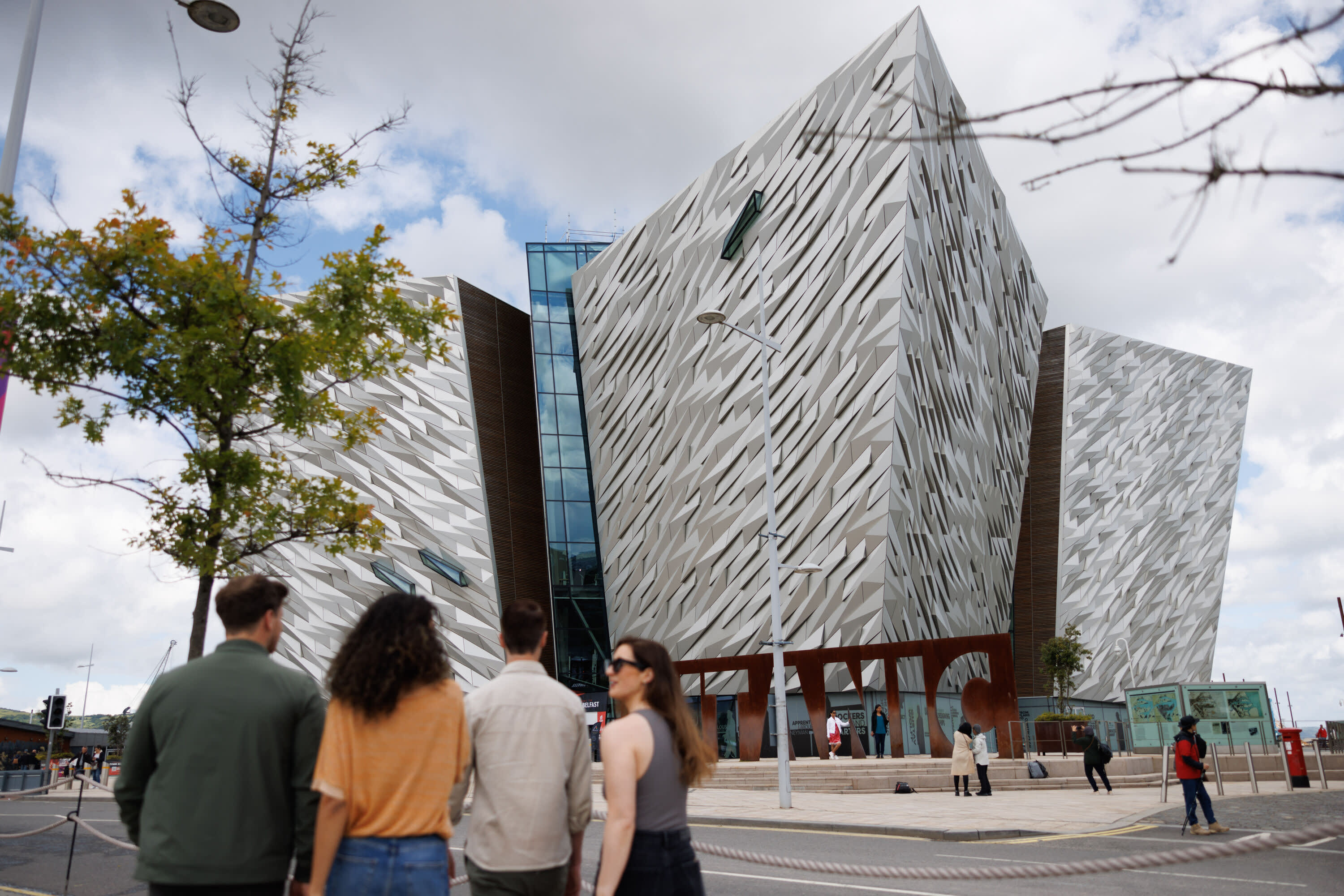 Group walking towards Titanic Belfast