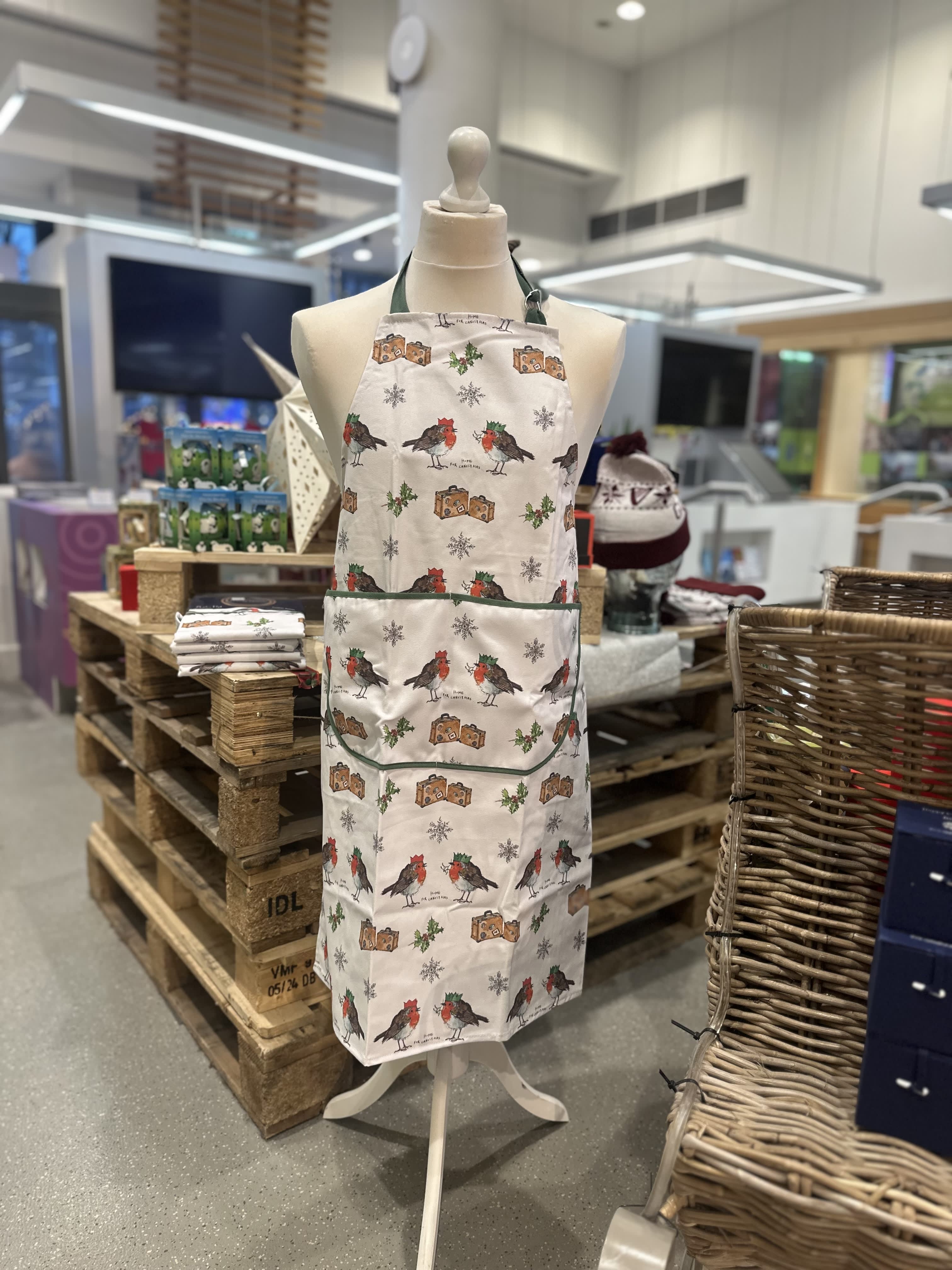 Christmas apron for sale with robbins on it at the welcome centre visit belfast