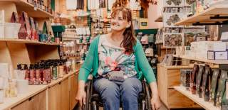 Woman in wheelchair shopping