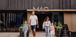 Family walking outside MAC