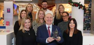 Photo of Visit Belfast team accepting an award.