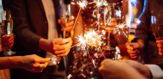 A group holding sparklers