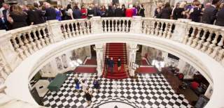 People in city hall rotunda.