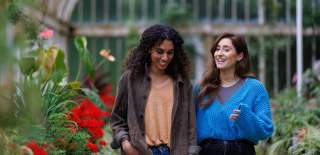 Two girls walking through the Tropical Ravine at Botanic Gardens.