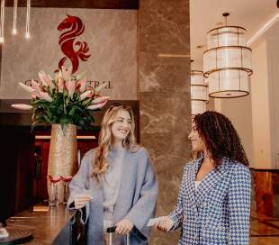 spring-24-grand-central-2-females-checking-in