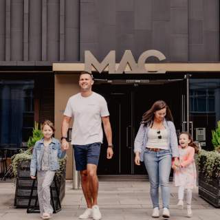 Family walking outside MAC