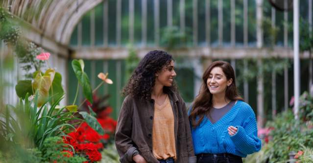 2 girls walking through the Tropical Ravine at Botanic Gardens.