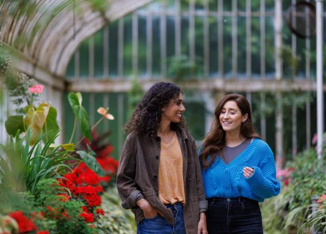 2 girls walking through the Tropical Ravine at Botanic Gardens.