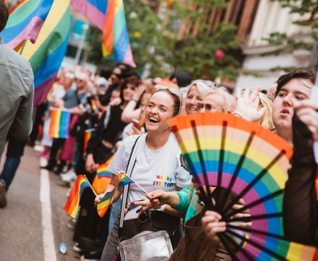 People lining the streets of Belfast for the annual Belfast Pride parade.