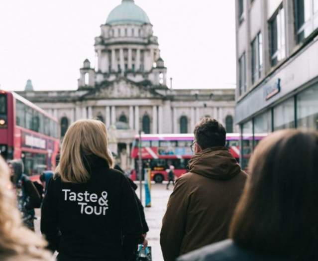People walking through Belfast on a taste and tour experience.