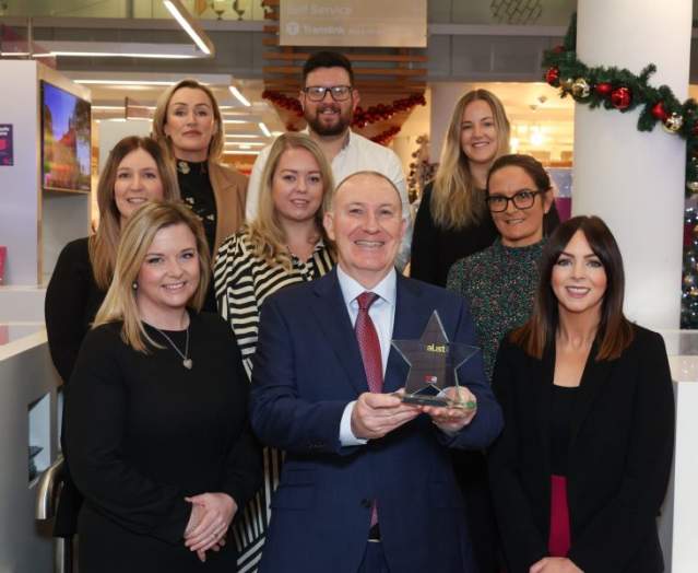 Conference support, team holding an award in Belfast.