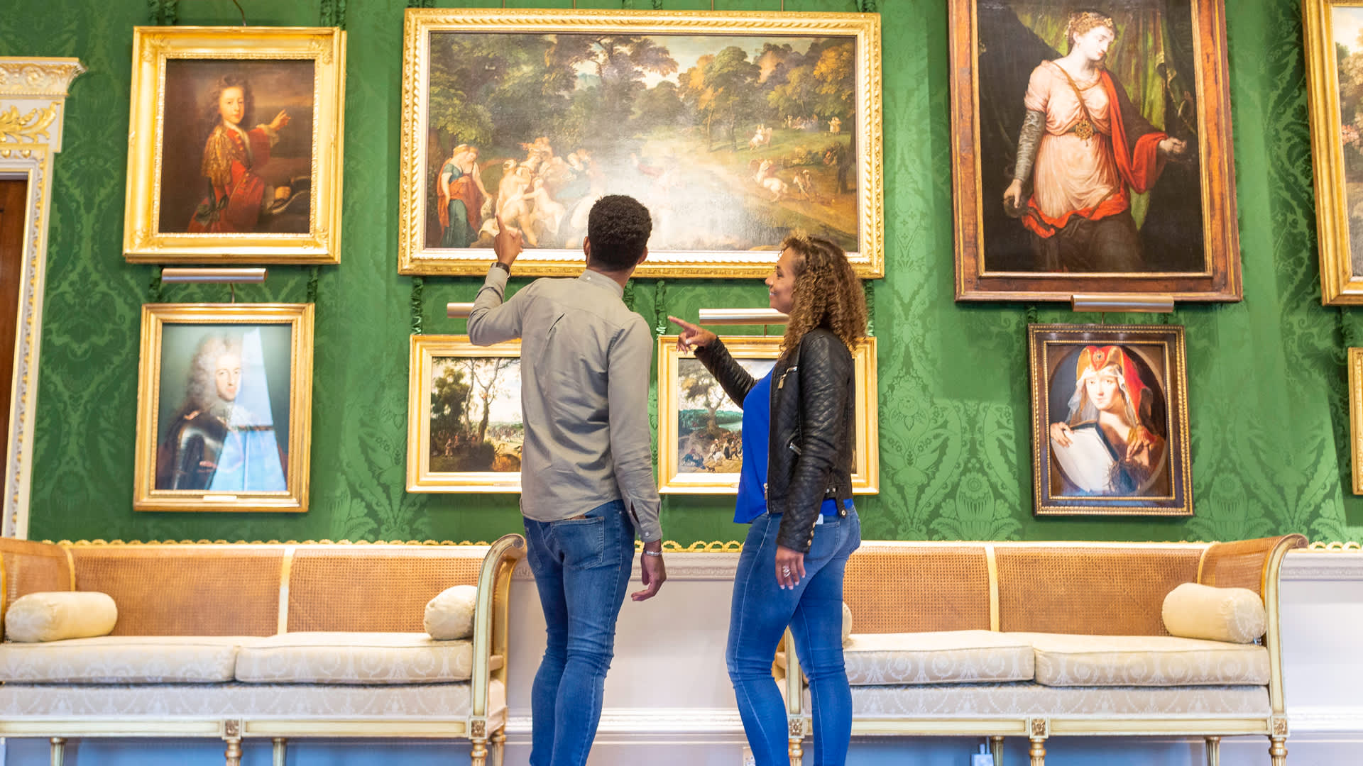 A couple looking at the artwork inside Hillsborough Castle and Gardens.