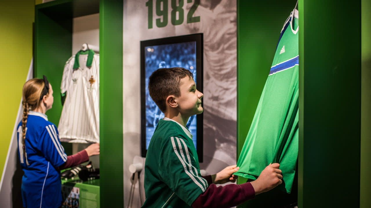 Boy looking at football jersey at Irish FA