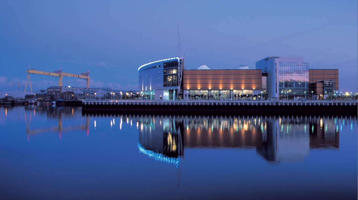 SSE Arena Belfast overlooking the water with Harland and Wolff in the background.