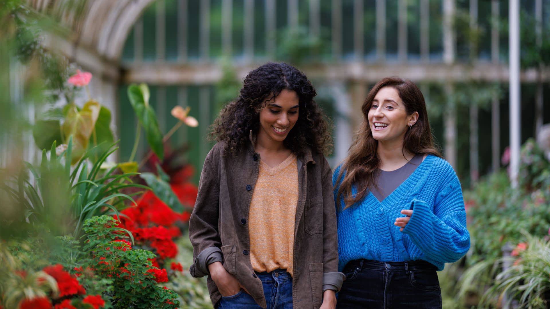 Two girls walking through the Tropical Ravine at Botanic Gardens.