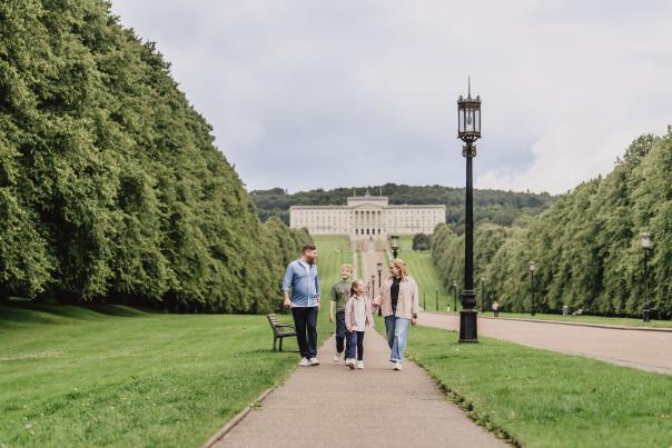 Family walking through Stormont Estate