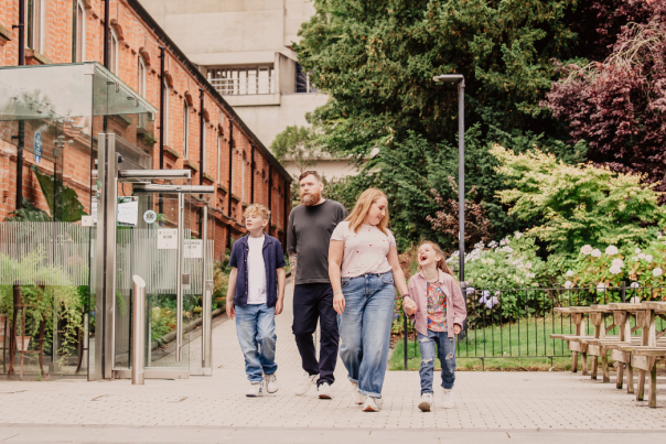 Family walking through botanic gardens