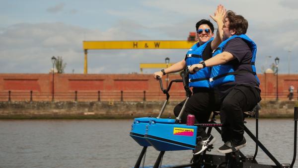 Two women riding a hydrobike on the River Lagan.