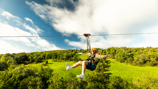 Man on zipline at Colin Glen