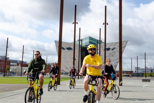 Group of people enjoying a bike tour around Titanic Quarter Belfast.