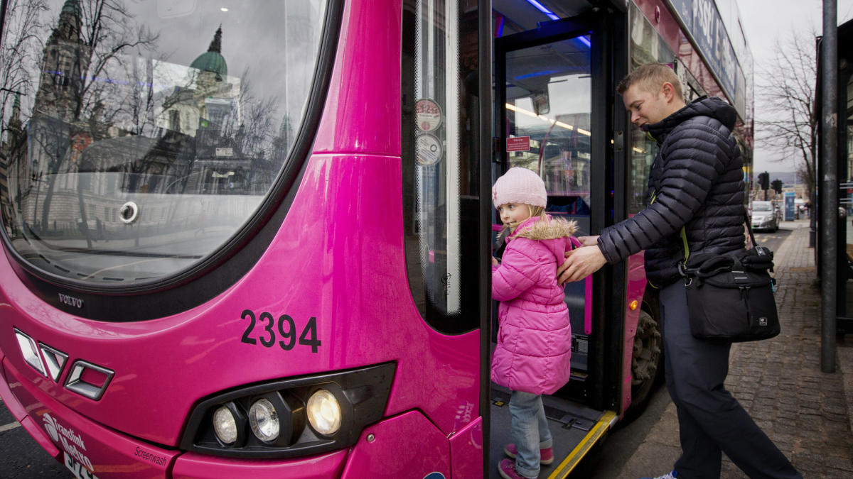 Family travelling on Translink Metro Bus