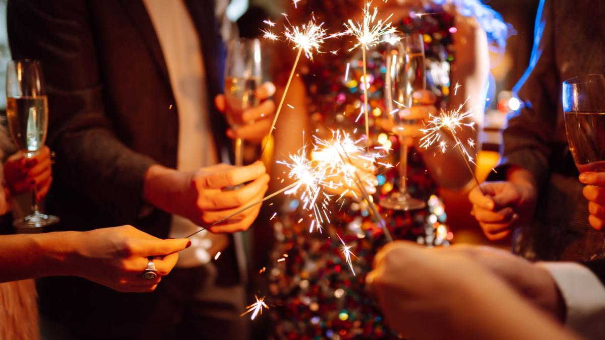 A group holding sparklers