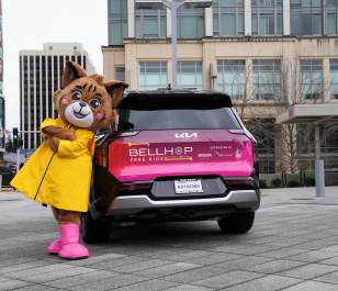 BellHop Kia vehicle with Belle the Bobcat