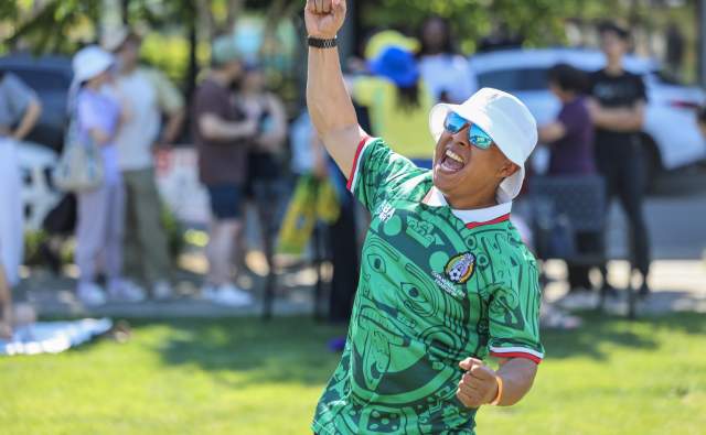 Soccer fan cheers for Mexico's goal at the Spring District Watch Party in Bellevue, Washington