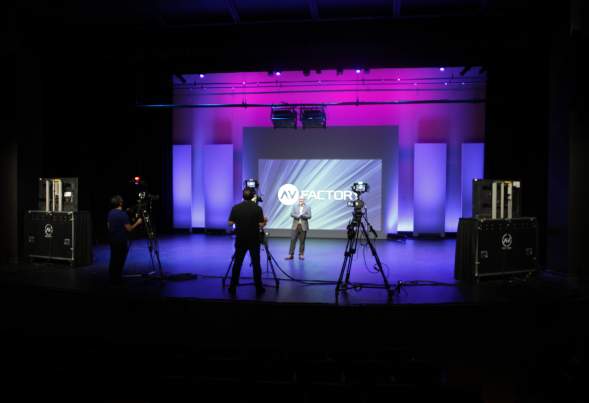 A film crew records a speaker at the Meydenbauer Center's Virtual Event Studio in Bellevue.