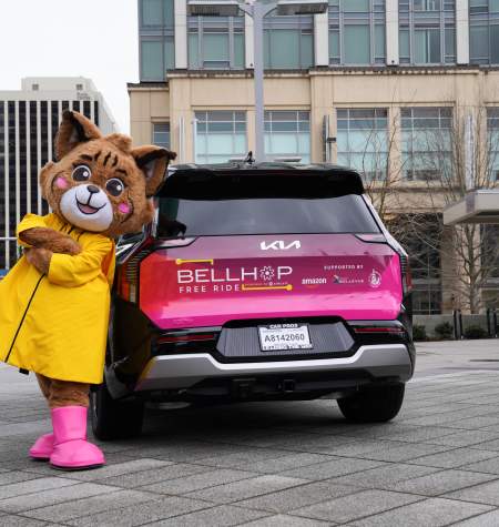 BellHop Kia vehicle with Belle the Bobcat
