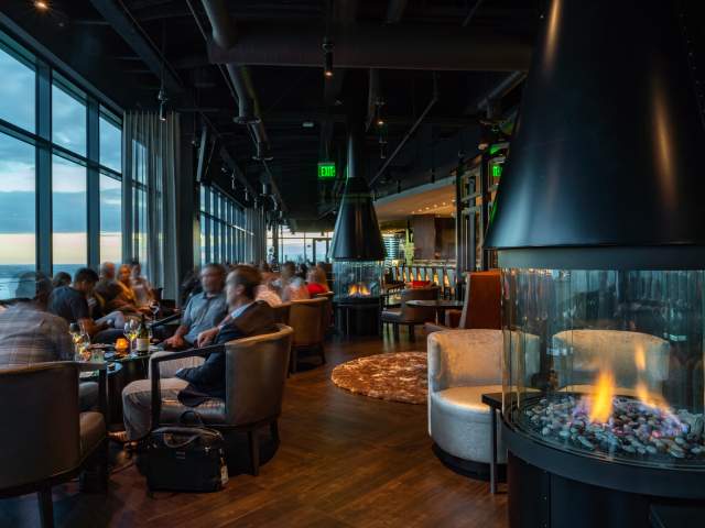 Ascend Steak and Sushi's cozy lounge with fire pit has expansive views