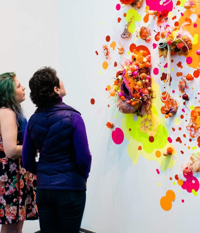 Couple exploring bright contemporary gallery display