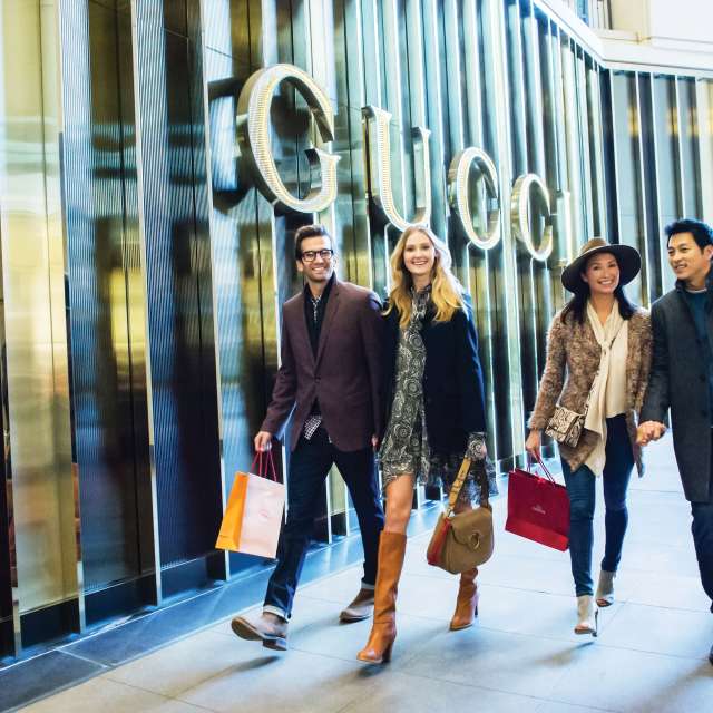 men women walking shopping