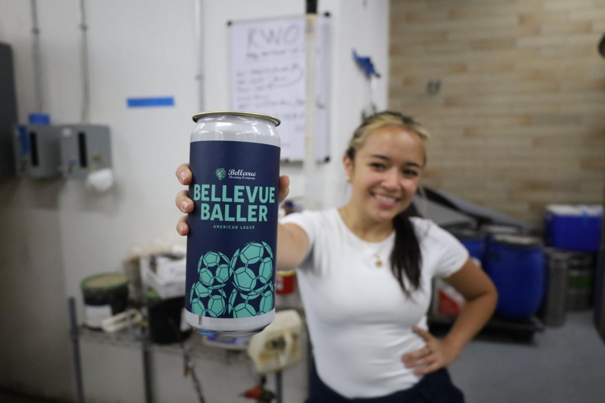 Girl holding Bellevue Baller Beer