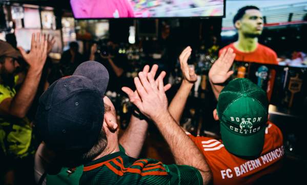 Crowd watching soccer at a Boston sports bar