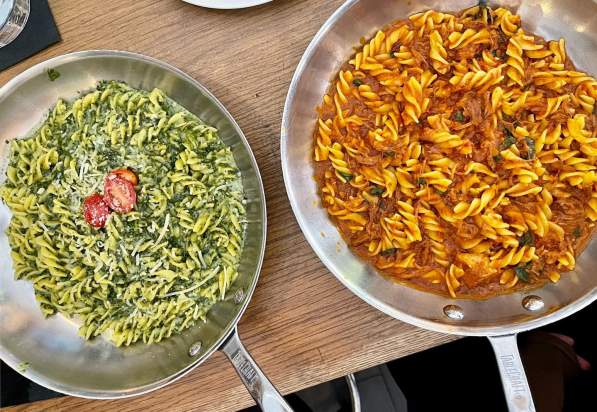 Two Italian dishes being served at Trattoria II Panino