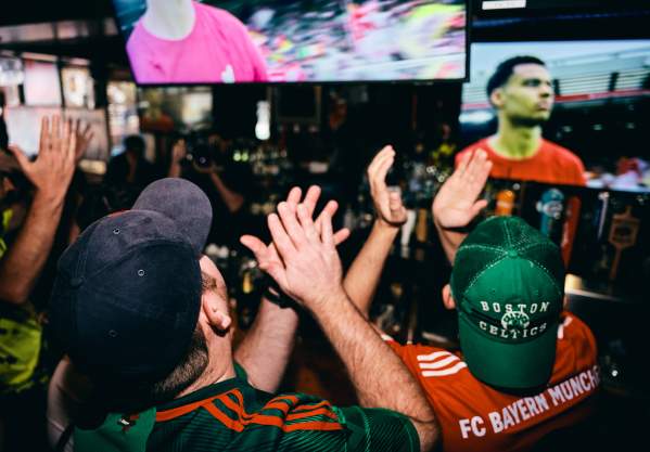 Crowd watching soccer at a Boston sports bar