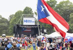 a crowd of people and stage at the Puerto Rican festival at Franklin Park