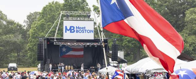 a crowd of people and stage at the Puerto Rican festival at Franklin Park
