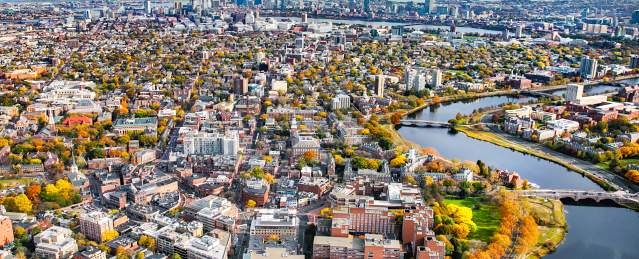 An aerial shot of Boston from Harvard Square with the trees changing in fall.