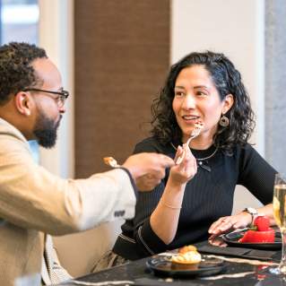 Two people dining at Trifecta